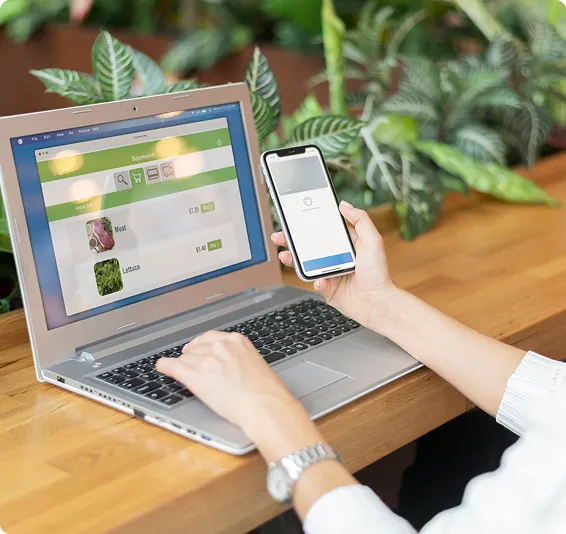 The image shows developers working on mobile app development.